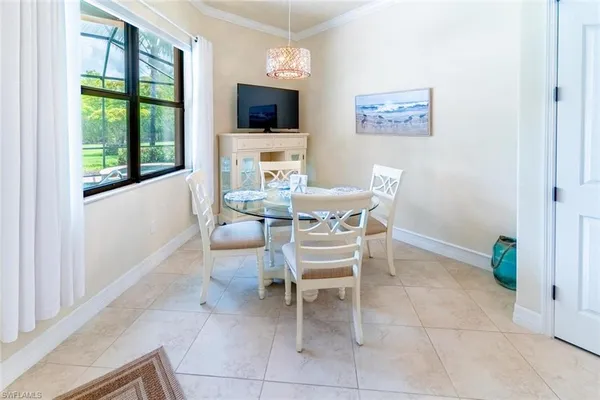 a dining room with furniture and window