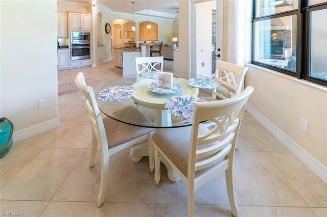 a dining room with furniture and wooden floor