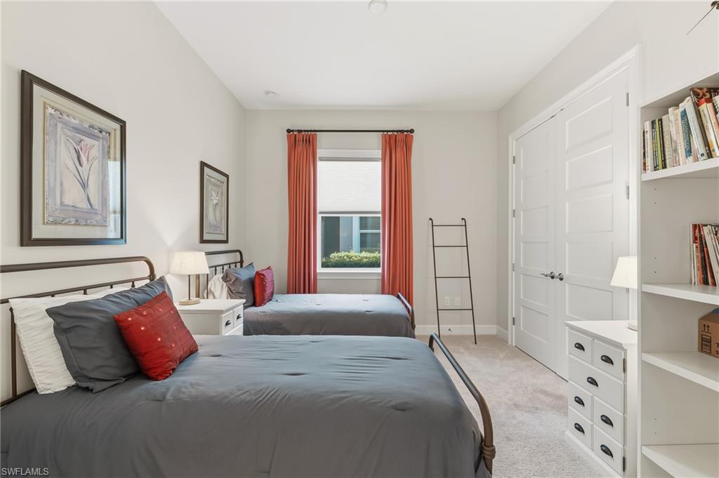 6939 Cay Court Naples, FL 34113 - Photo 14 of 30 a bedroom with a bed and a window