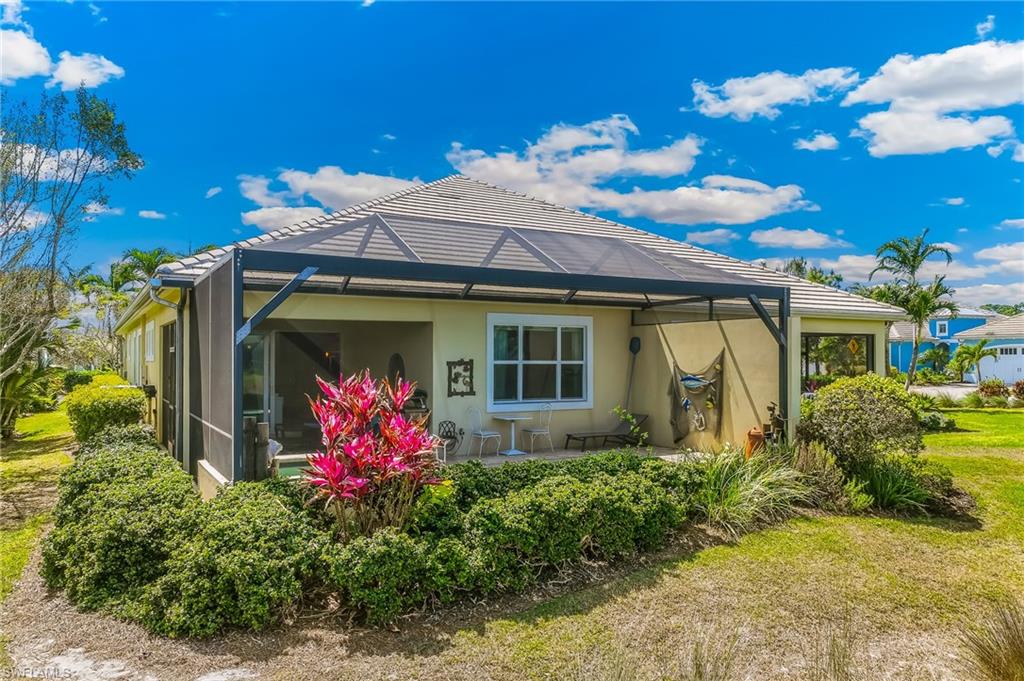 6939 Cay Court Naples, FL 34113 - Photo 20 of 30 a front view of house with an outdoor space