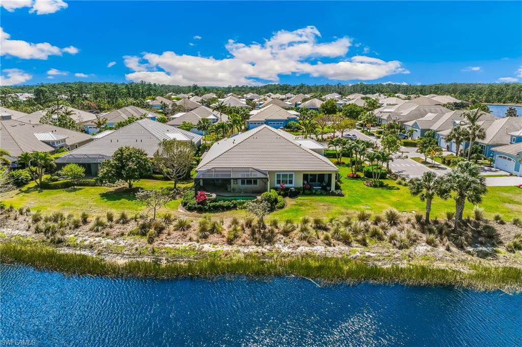 6939 Cay Court Naples, FL 34113 - Photo 23 of 30 a view of a garden with an ocean