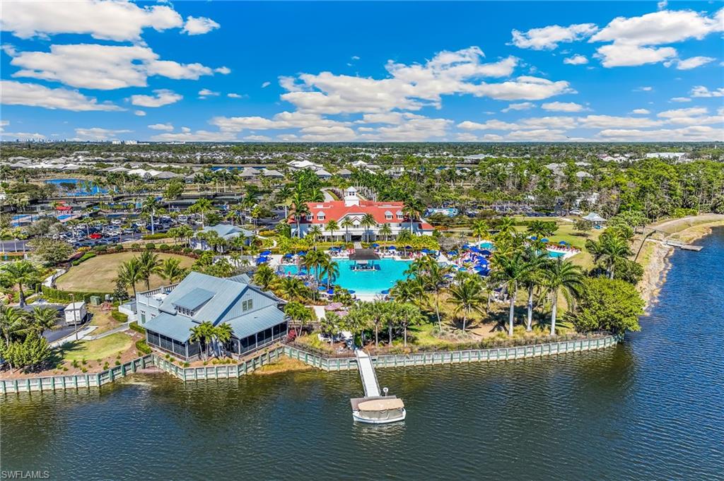 6939 Cay Court Naples, FL 34113 - Photo 28 of 30 a view of a lake with lawn chairs