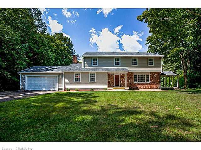 1064 Durham Road Guilford, CT 06437 - Photo 1 of 1 a front view of a house with a garden