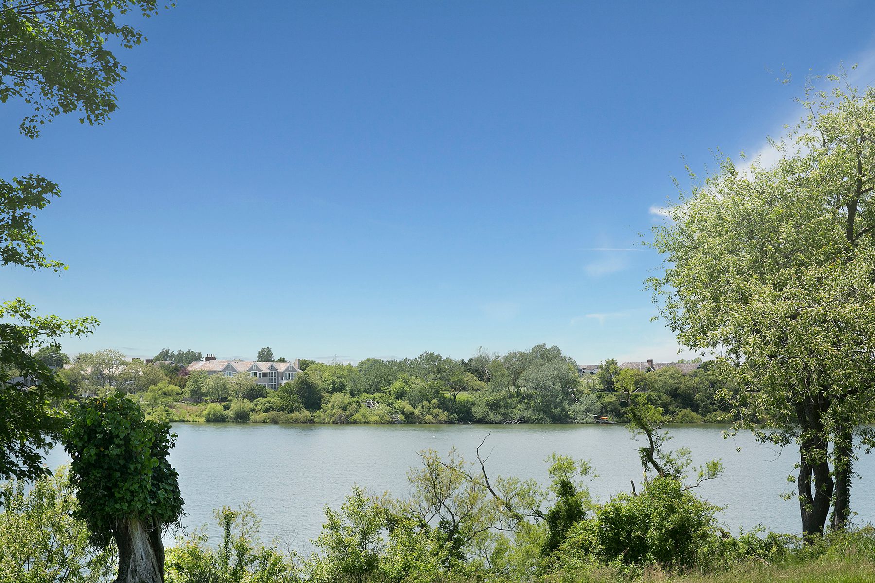 9 Morgan Hill Way Bridgehampton, NY 11932 - Photo 18 of 18 a view of a lake with houses in the back