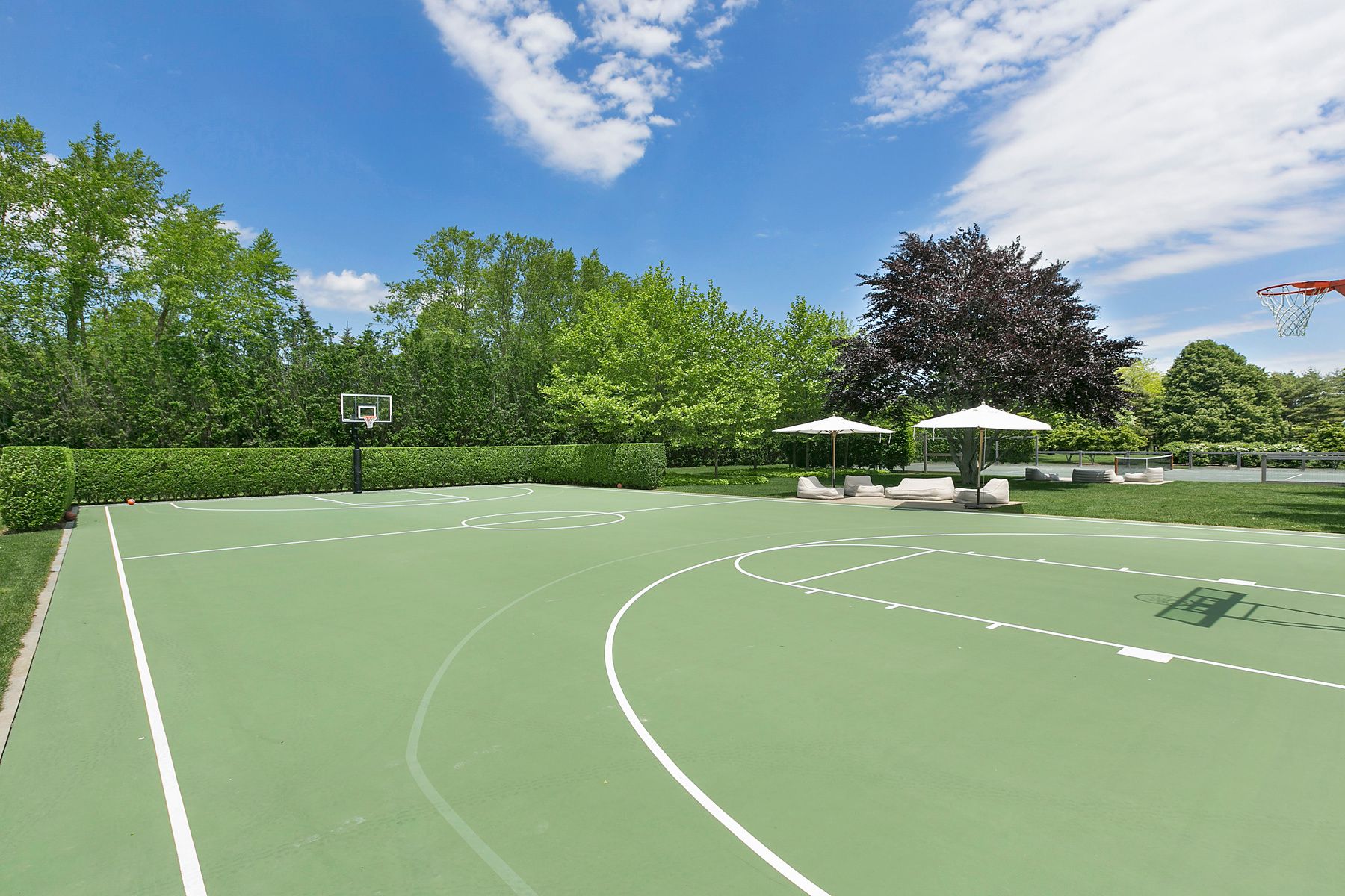9 Morgan Hill Way Bridgehampton, NY 11932 - Photo 6 of 18 a view of a tennis ground with a large trees