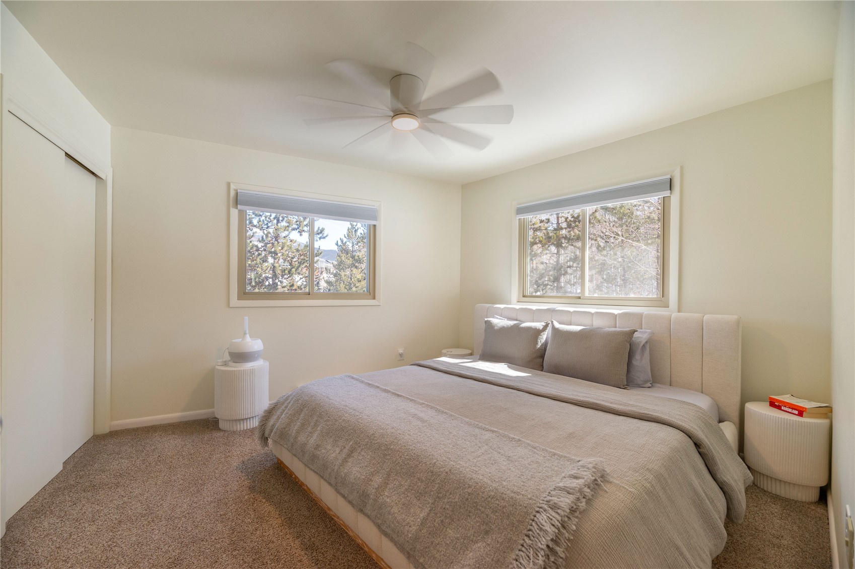 340 Buffalo Street Dillon, CO 80435 - Photo 19 of 40 a bedroom with a large bed and a window