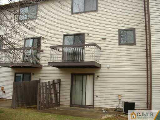 5705 Hana Road Edison, NJ 08817 - Photo 6 of 8 a view of a house with wooden deck