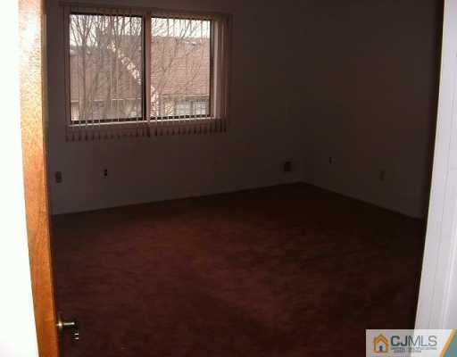 5705 Hana Road Edison, NJ 08817 - Photo 7 of 8 an empty room with a window