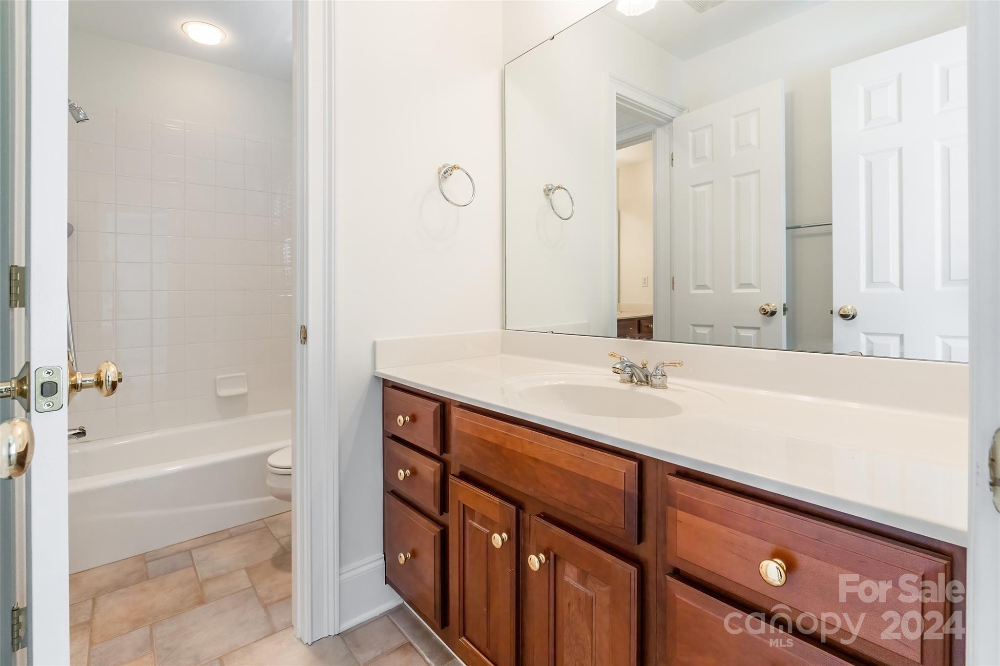 738 Portpatrick Place Fort Mill, SC 29708 - Photo 14 of 27 a bathroom with a sink double vanity and a bathtub