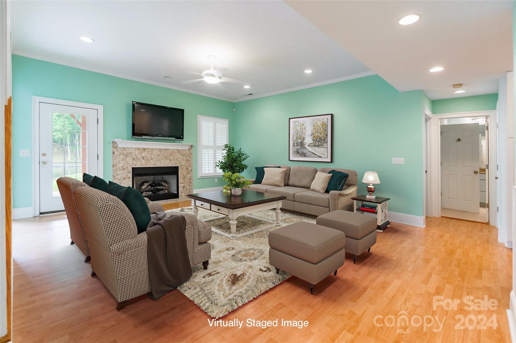 738 Portpatrick Place Fort Mill, SC 29708 - Photo 16 of 27 a living room with furniture a flat screen tv and a fireplace