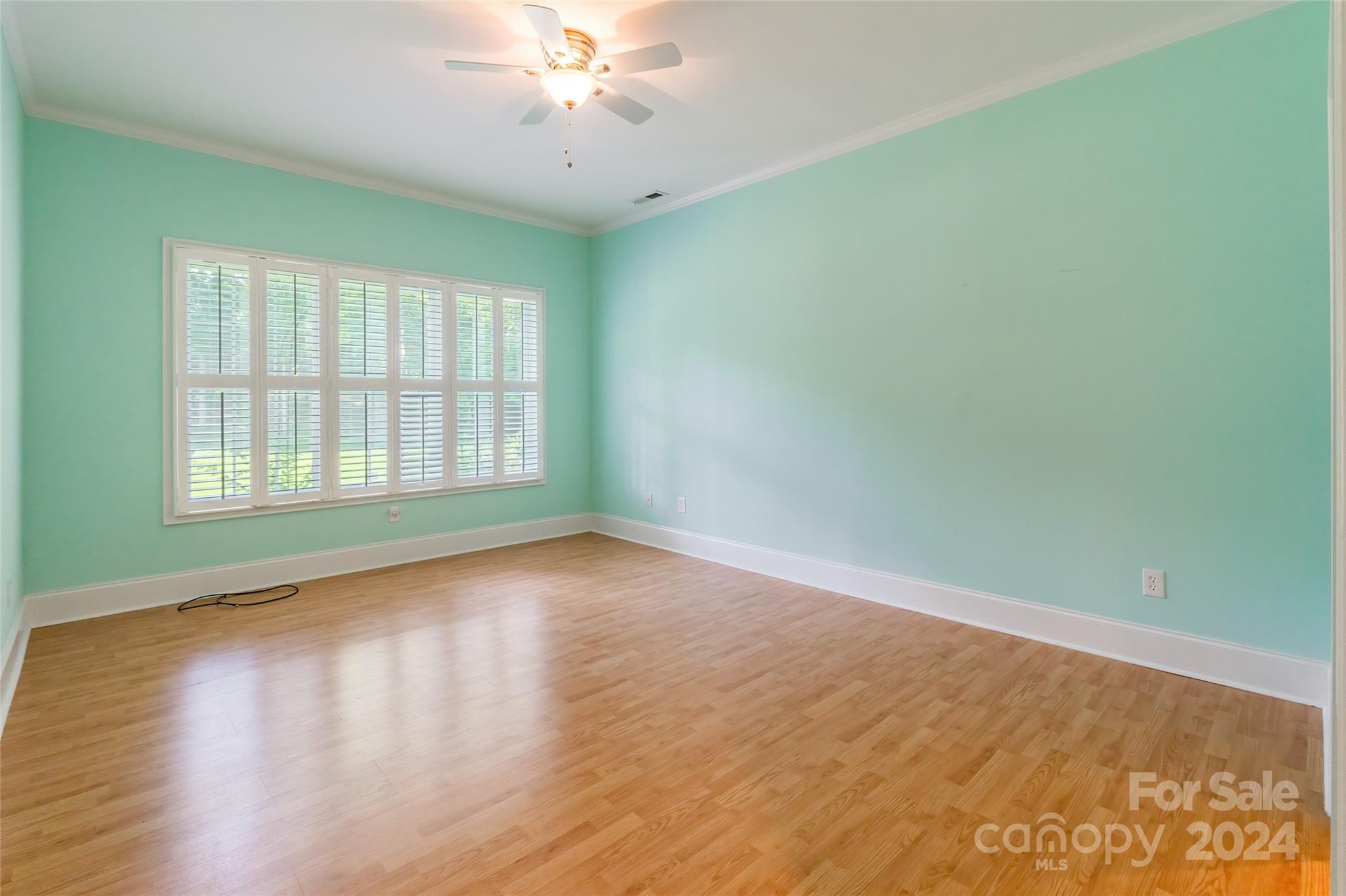738 Portpatrick Place Fort Mill, SC 29708 - Photo 19 of 27 an empty room with wooden floor and windows