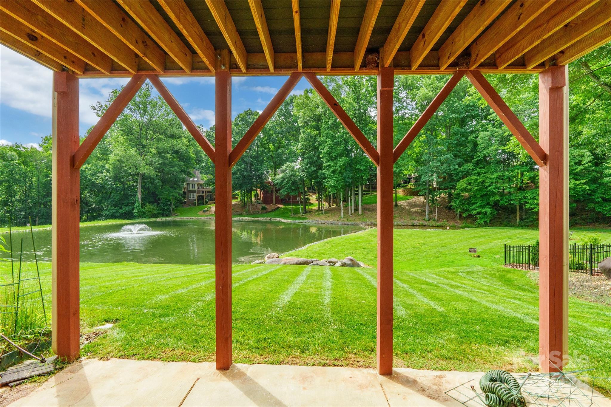 738 Portpatrick Place Fort Mill, SC 29708 - Photo 23 of 27 a view of backyard with large trees and plants