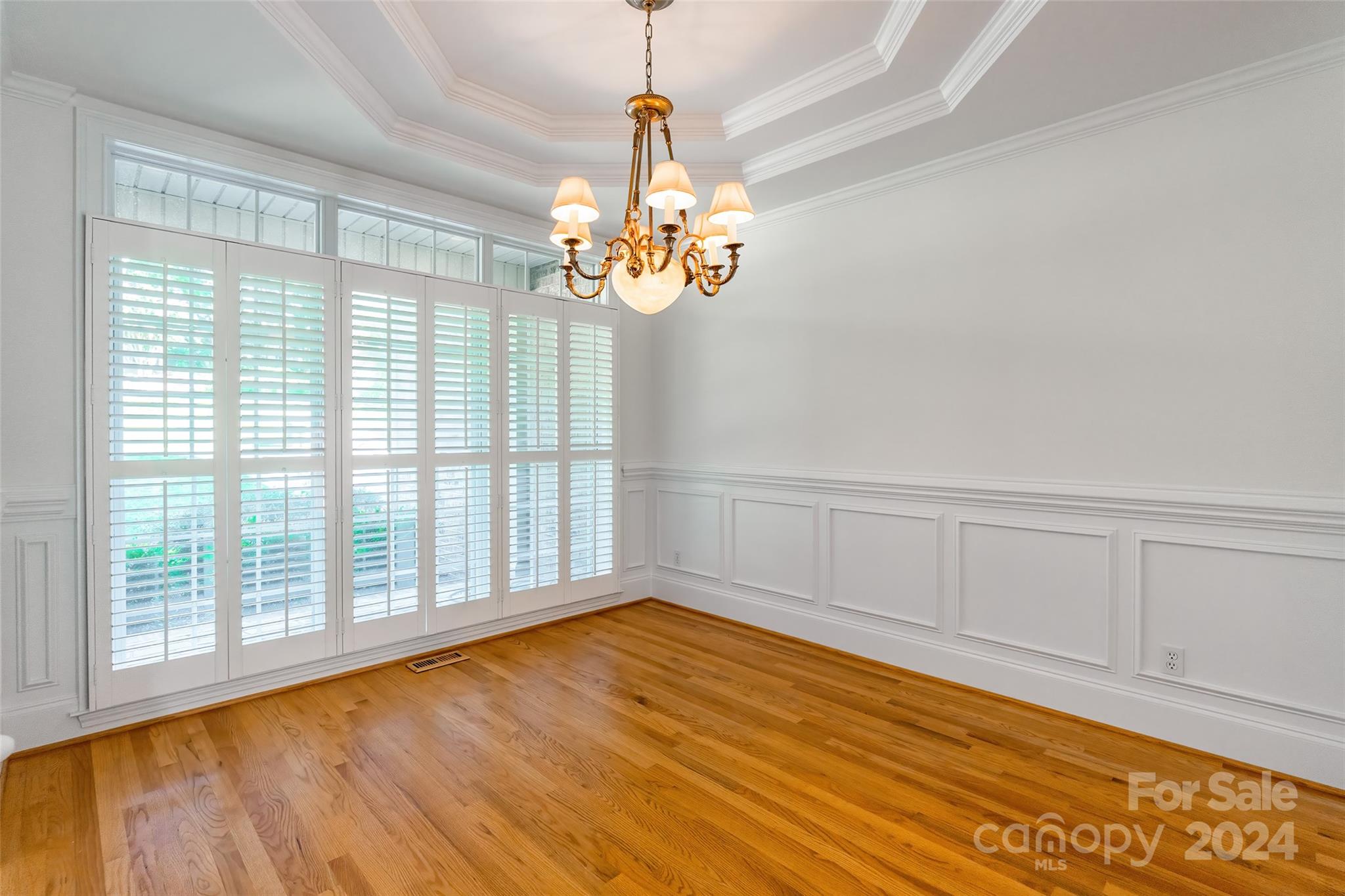 738 Portpatrick Place Fort Mill, SC 29708 - Photo 4 of 27 a view of empty room with wooden floor and fan