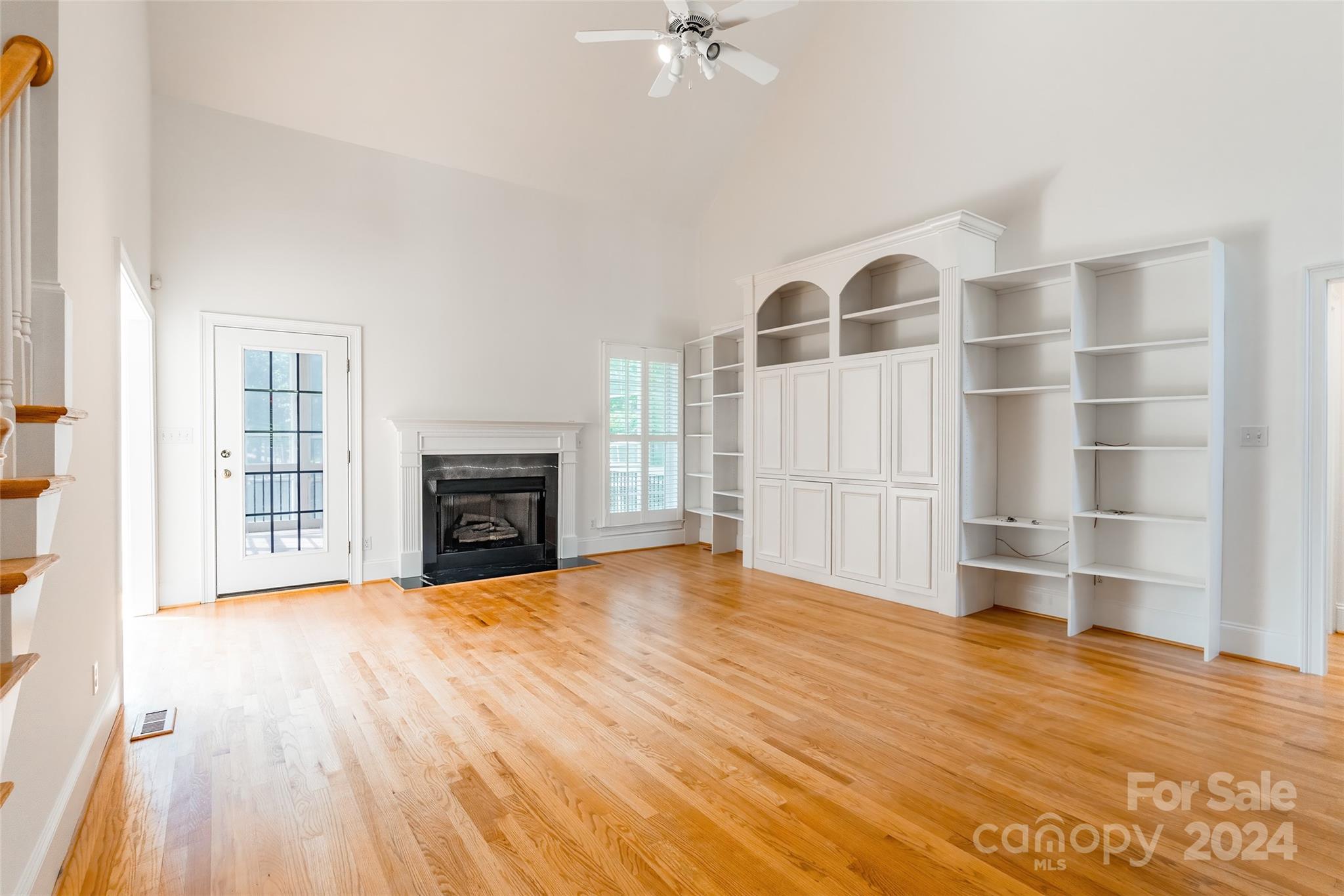 738 Portpatrick Place Fort Mill, SC 29708 - Photo 5 of 27 a view of an empty room with a fireplace and a window