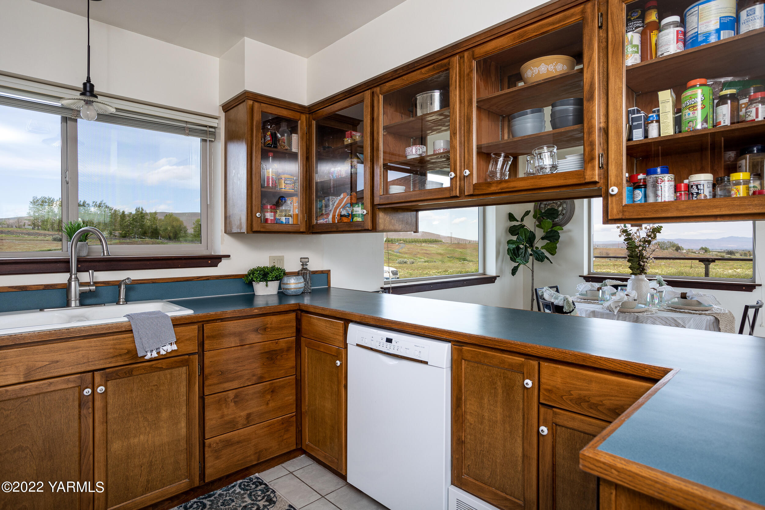 2450 Cook Road Yakima, WA 98908 - Photo 13 of 52 a kitchen with stainless steel appliances granite countertop a sink and a stove next to a window