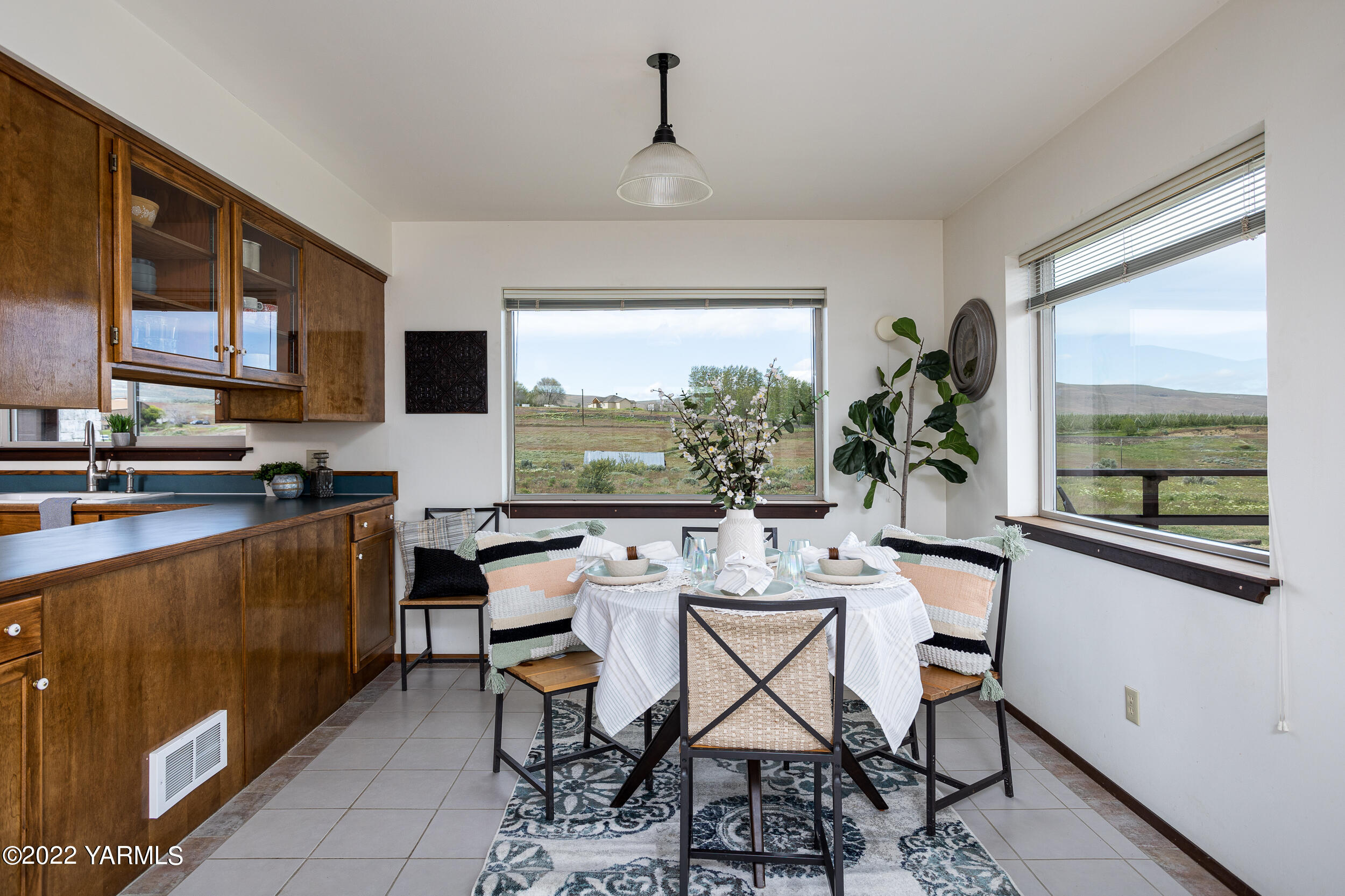 2450 Cook Road Yakima, WA 98908 - Photo 15 of 52 a view of a dining room with furniture window and outside view