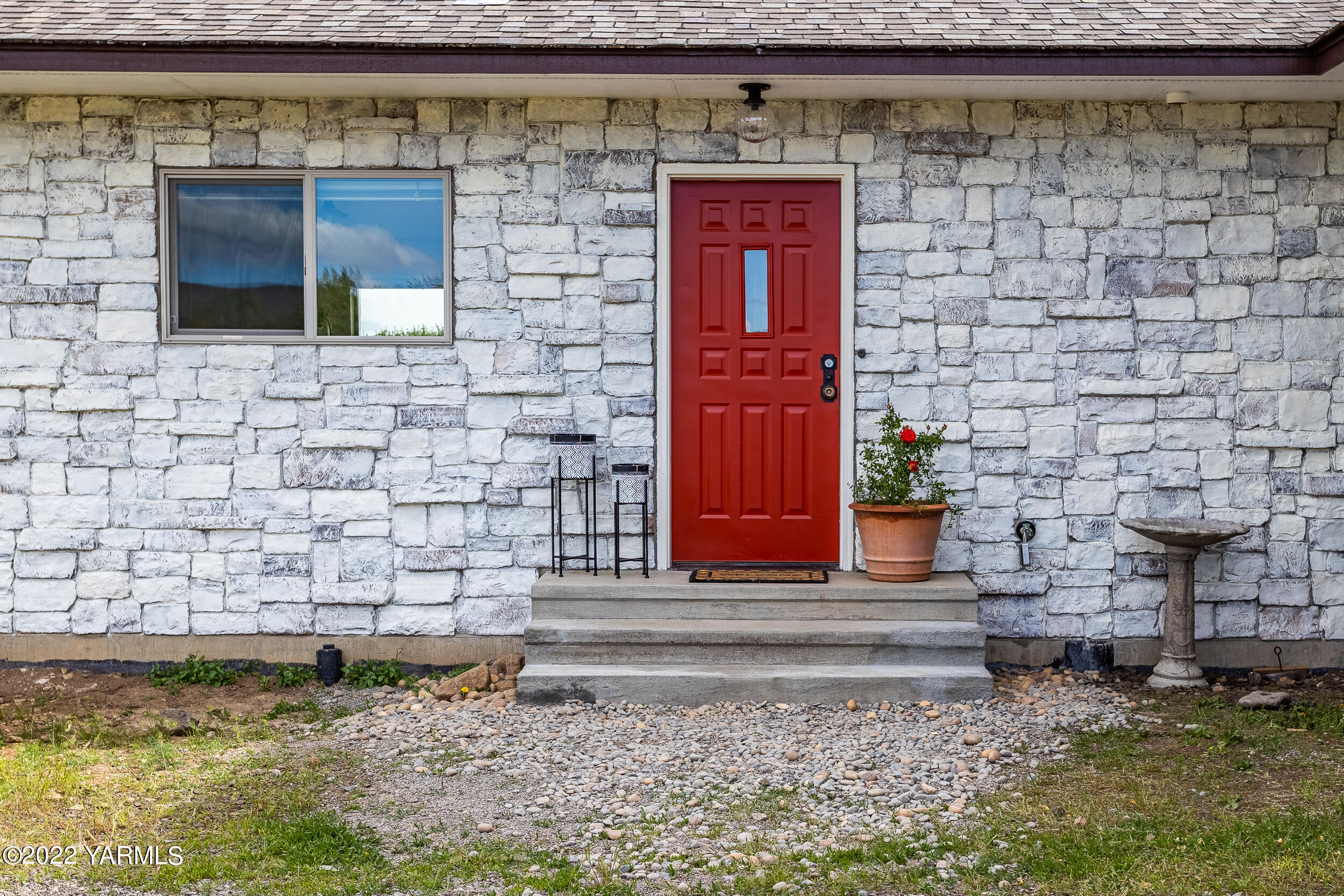 2450 Cook Road Yakima, WA 98908 - Photo 6 of 52 a brick building with a bench in front of it