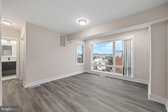 a view of room with wooden floor