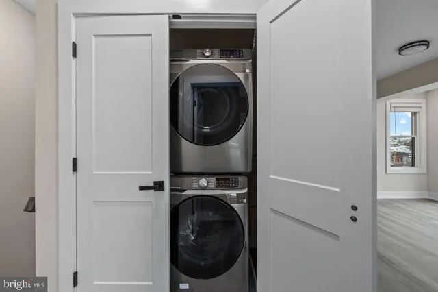 a bathroom with a sink mirror and toilet
