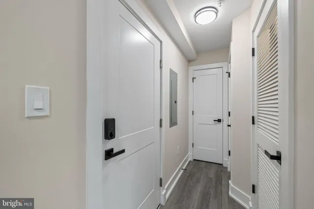 a large kitchen with stainless steel appliances granite countertop a lot of counter space and wooden floor