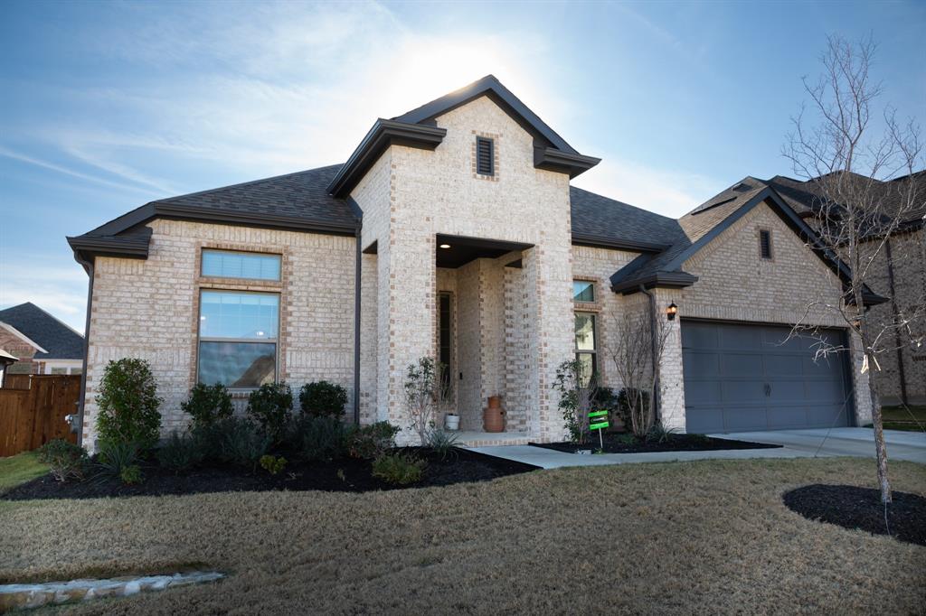 9428 Surveyor Road Oak Point, TX 75068 - Photo 1 of 1 a front view of a house with garden