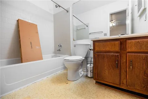 a bathroom with a toilet and a sink