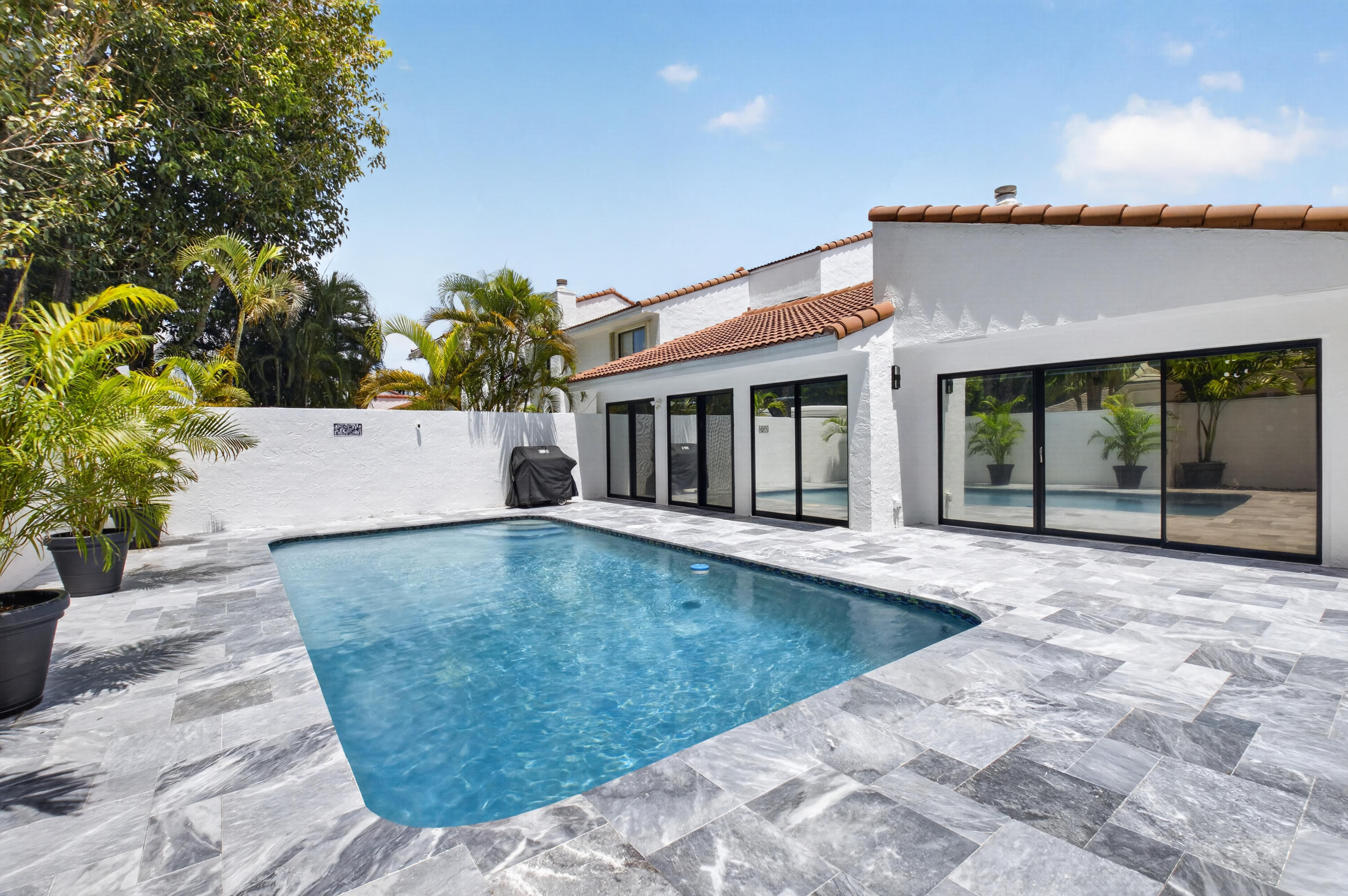 7374 Woodmont Court Boca Raton, FL 33434 - Photo 42 of 95 a view of a house with a swimming pool