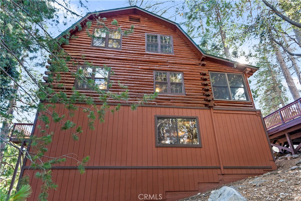 26638 Lake Forest Drive Twin Peaks, CA 92391 - Photo 15 of 72 a front view of a house with a tree