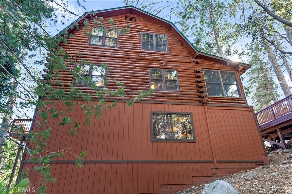 26638 Lake Forest Drive Twin Peaks, CA 92391 - Photo 23 of 72 a front view of a house with a tree