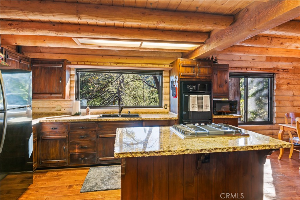 26638 Lake Forest Drive Twin Peaks, CA 92391 - Photo 30 of 72 a view of a kitchen with granite countertop a sink and a stove