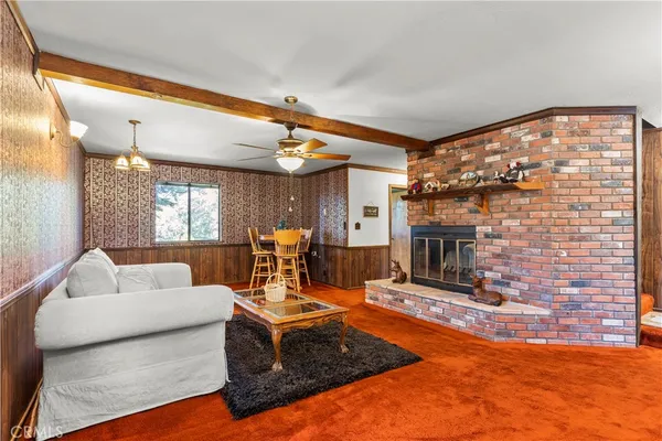 a bathroom with a sink a washer and dryer next to a window