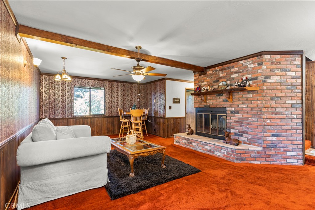 26638 Lake Forest Drive Twin Peaks, CA 92391 - Photo 36 of 72 a living room with furniture and a fireplace