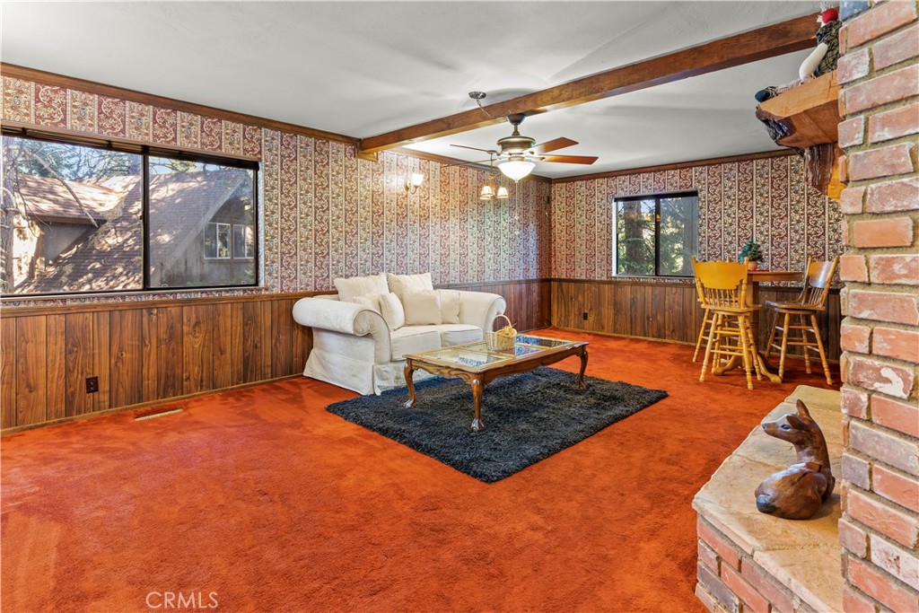 26638 Lake Forest Drive Twin Peaks, CA 92391 - Photo 38 of 72 a living room with furniture a rug and a large window