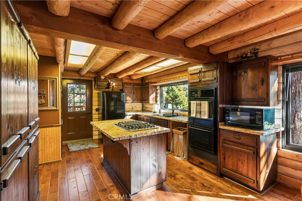 26638 Lake Forest Drive Twin Peaks, CA 92391 - Photo 7 of 72 a kitchen with stainless steel appliances granite countertop a stove a sink and a refrigerator