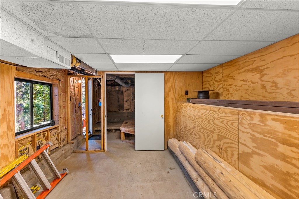 26638 Lake Forest Drive Twin Peaks, CA 92391 - Photo 9 of 72 a view of an empty room with a window