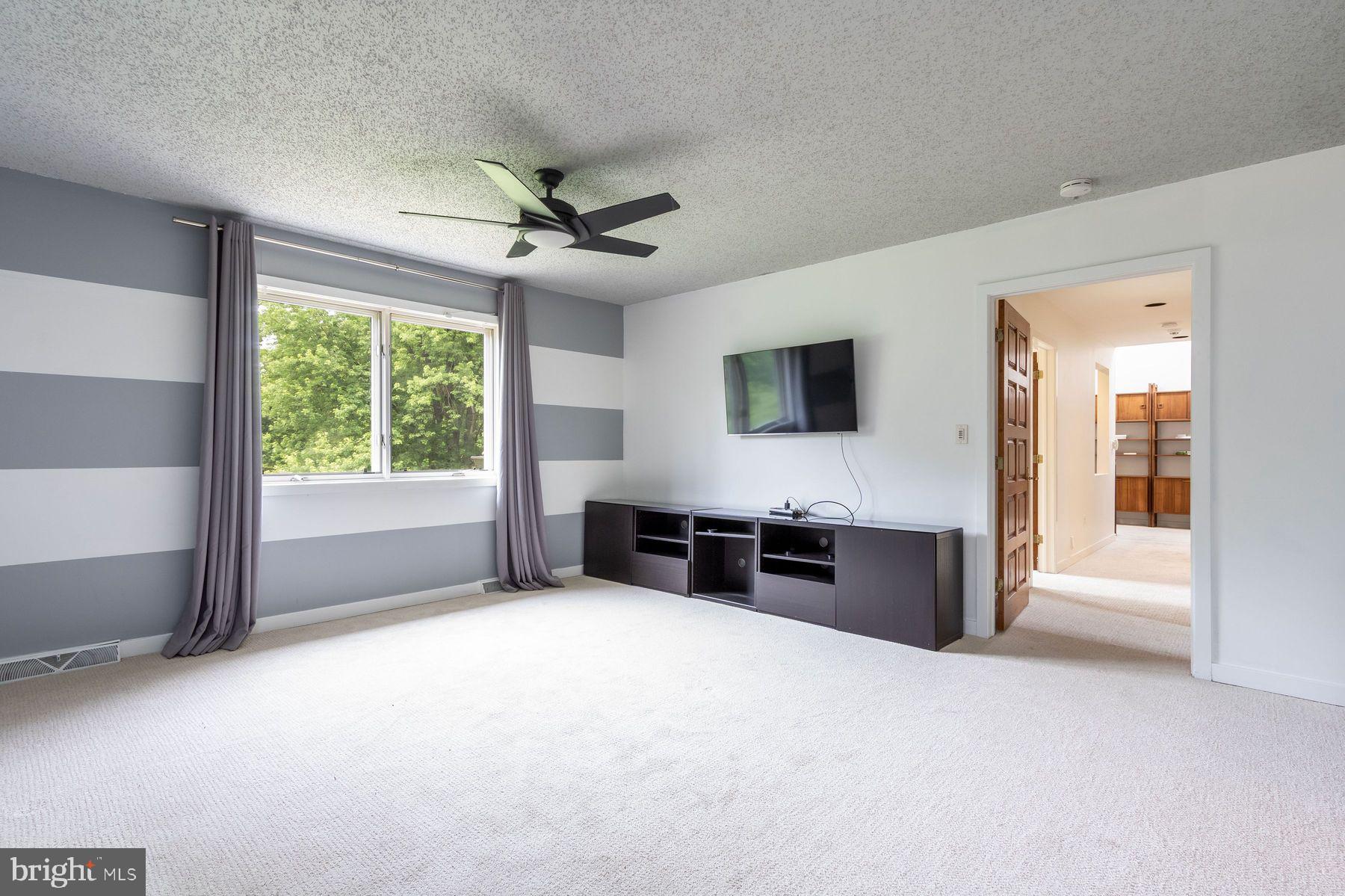 125 Edison Furlong Road Doylestown, PA 18901 - Photo 25 of 51 a view of a big room with windows cabinet and a living room