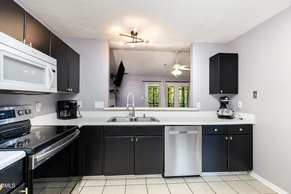a view of a room with window and flower pot