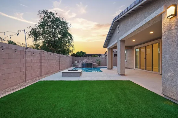 a view of a backyard with plants and a backyard