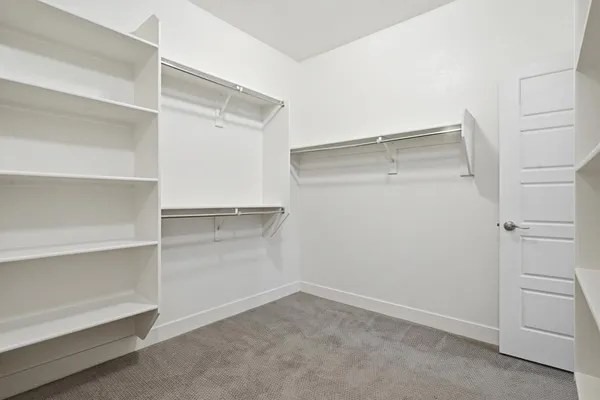 a view of an empty walk in closet