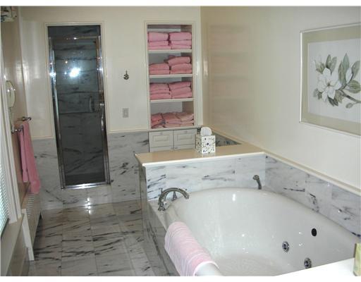 Undisclosed Address Darien, CT 06820 - Photo 17 of 20 a bathroom with a tub sink and mirror