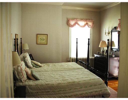 Undisclosed Address Darien, CT 06820 - Photo 19 of 20 a bedroom with a bed and a mirror