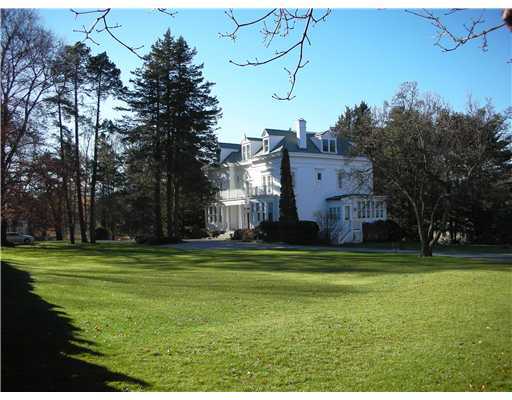 Undisclosed Address Darien, CT 06820 - Photo 3 of 20 a big house with a big yard and large trees
