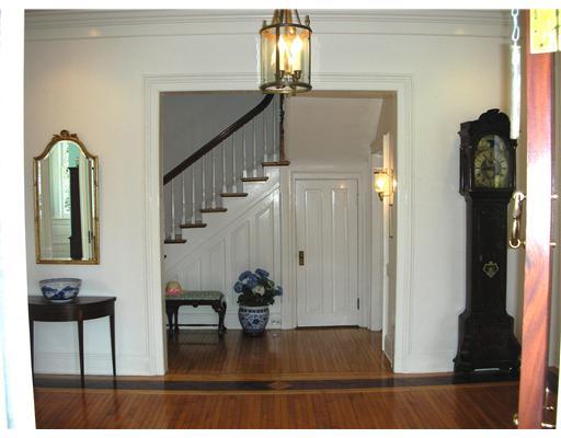 Undisclosed Address Darien, CT 06820 - Photo 5 of 20 a view of entryway and hall with a mirror