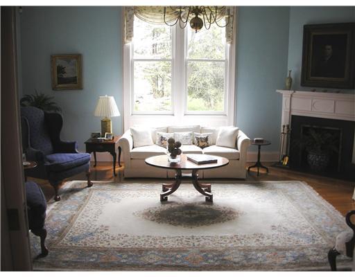 Undisclosed Address Darien, CT 06820 - Photo 7 of 20 a living room with furniture a fireplace and a window
