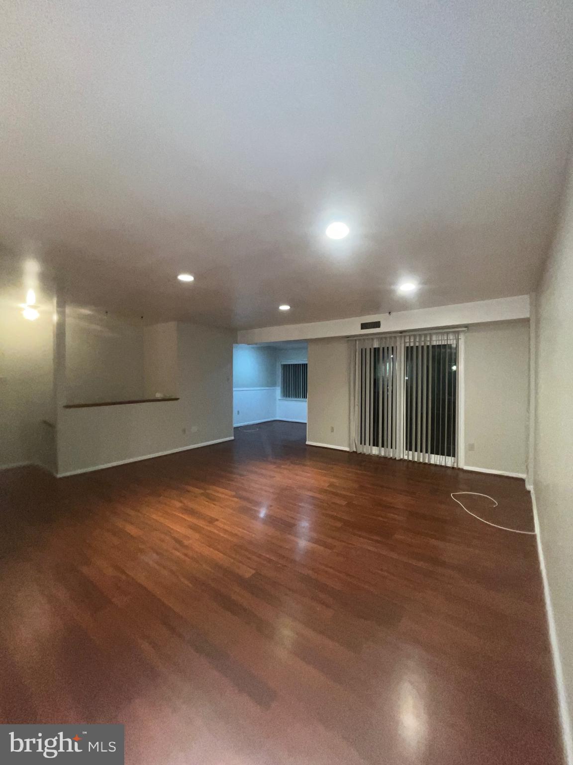 3204 Delaire Landing Road, Unit 3204 Philadelphia, PA 19114 - Photo 6 of 8 an empty room with wooden floor and natural light
