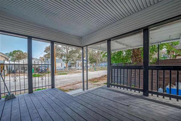 a view of a balcony with wooden floor