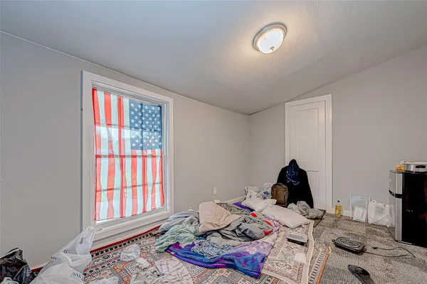 a bed room with furniture and a window
