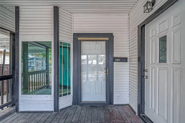 a view of a brick house with a large window