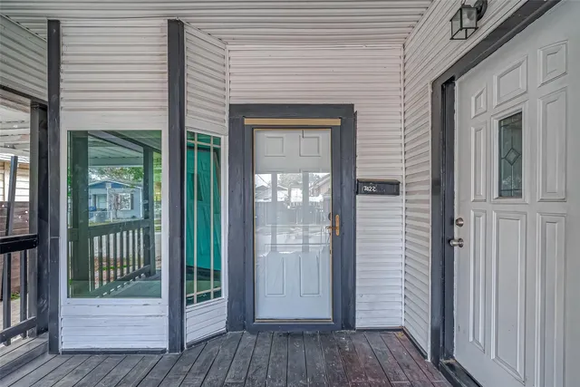a view of a brick house with a large window