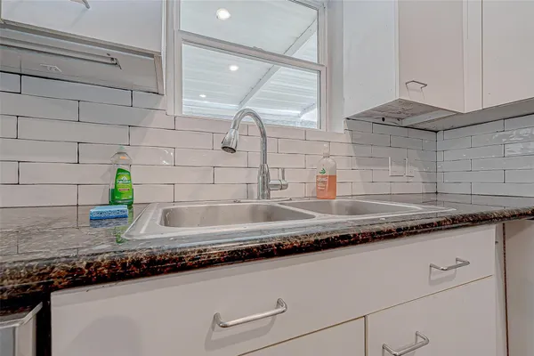 a close view of sink and mirror